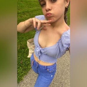 Adorable blue crop back exposed.